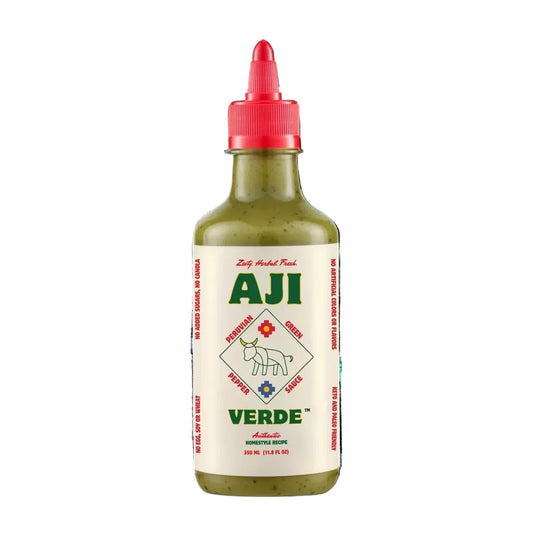 Bottle of Aji Verde sauce with a red cap on a white background