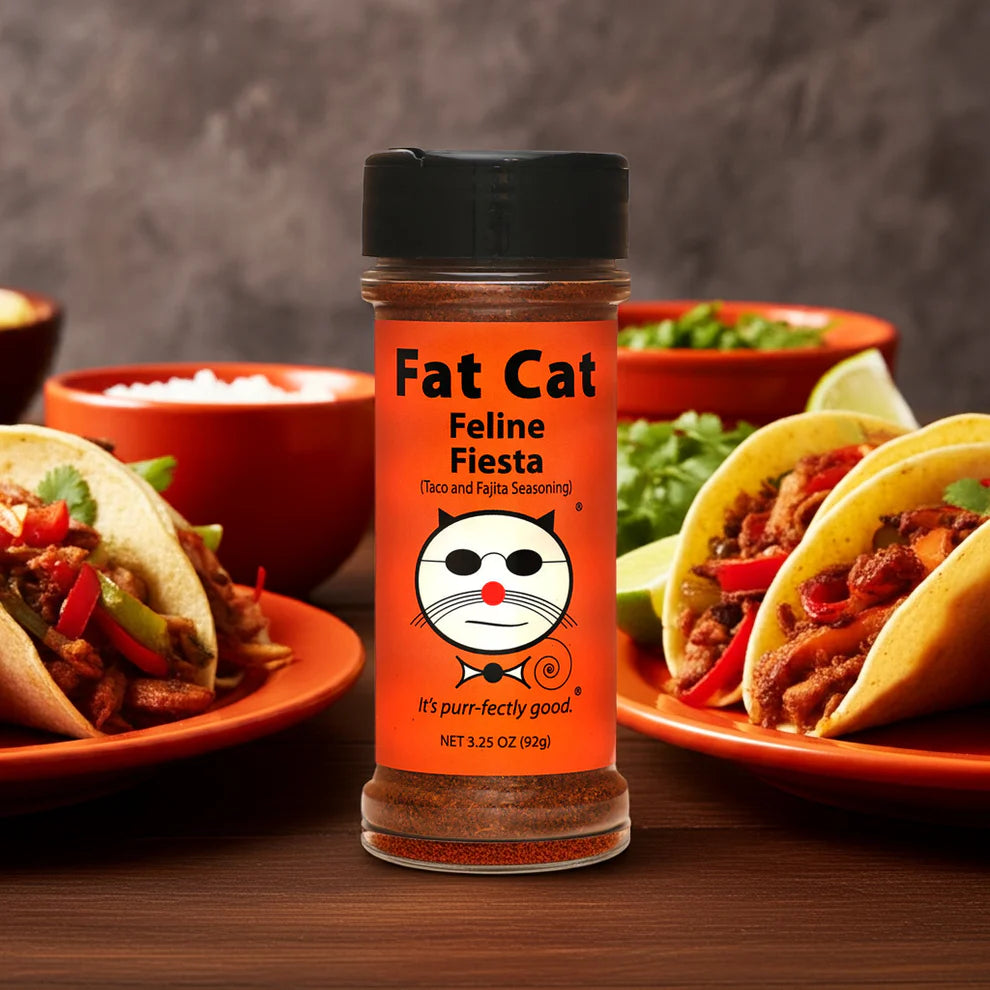 Fat Cat Feline Fiesta seasoning bottle with tacos in the background