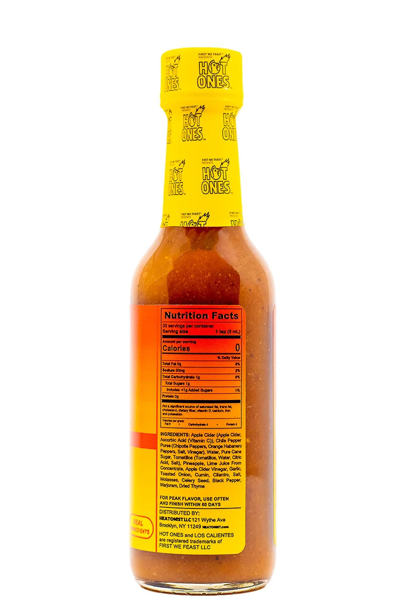 A bottle of Hot Ones hot sauce shown from the back, featuring a bright yellow cap and a yellow label with red and orange accents, on a solid white background.