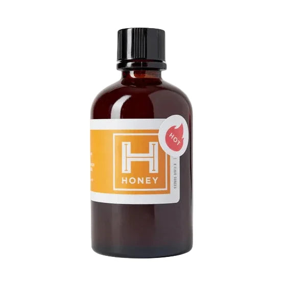 Bottle of HC Hot honey with a label on a white background