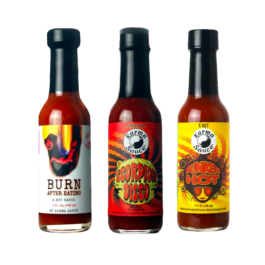 Three bottles of Karma Sauce with colorful labels on a white background