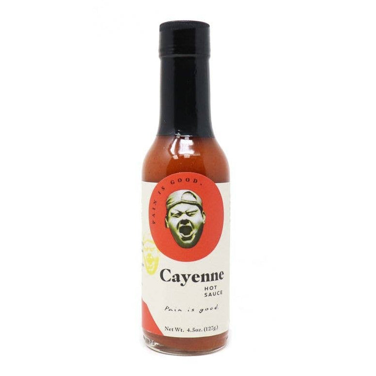 Bottle of Pain is Good Cayenne hot sauce with a label featuring a face on a white background