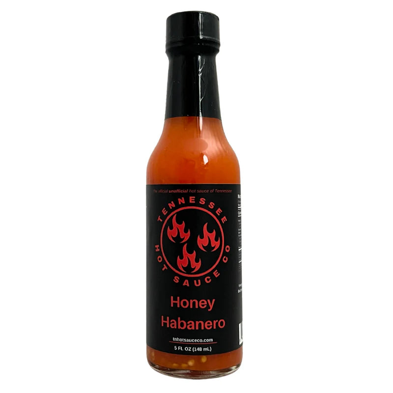 Bottle of Tennessee Hot Sauce Honey Habanero on a white background