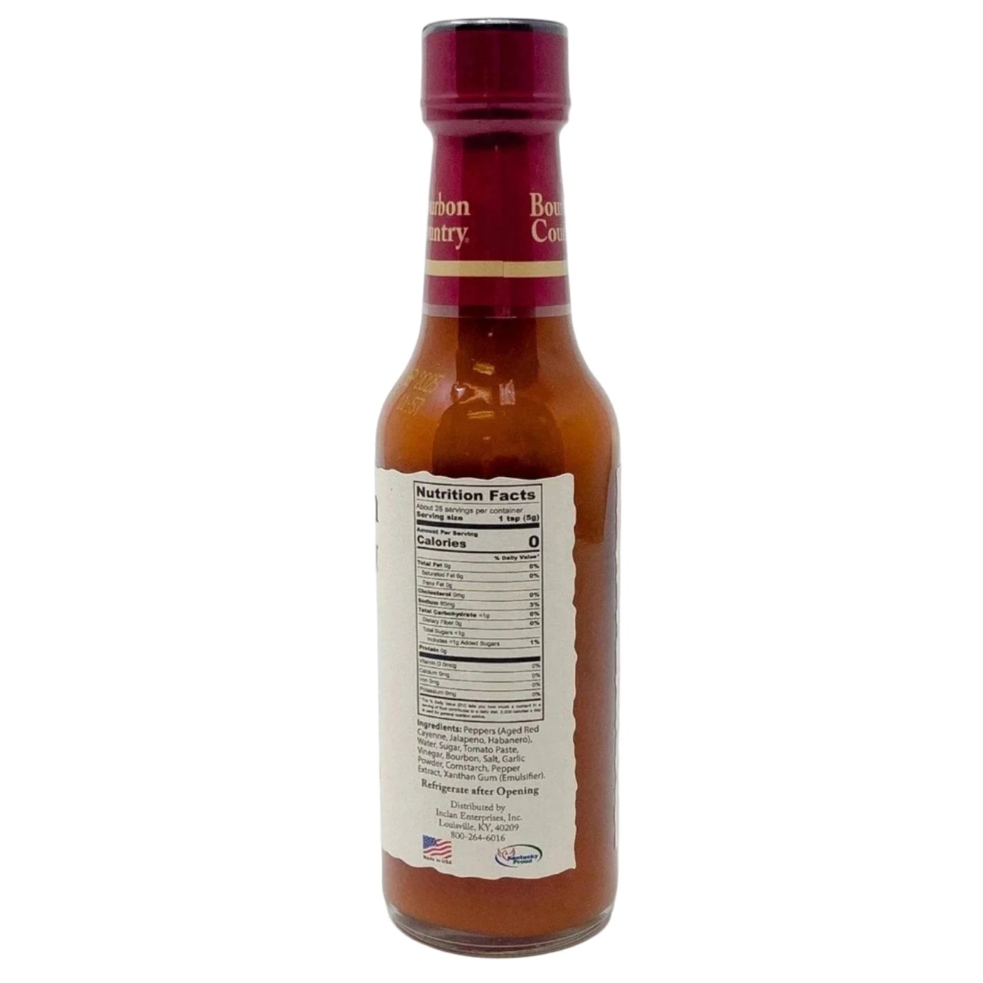 Bottle of Country Bourbon habanero hot sauce with a label on a white background