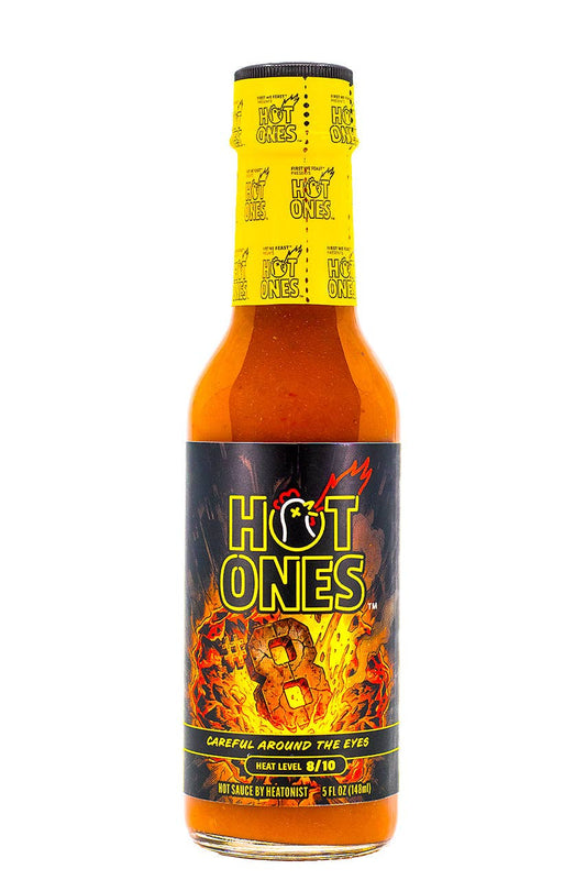 Hot Ones hot sauce bottle with yellow cap and black label on a white background
