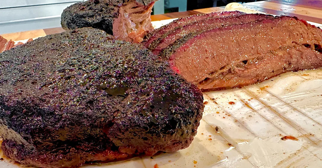 Smoked meat on a cutting board with a blurred background