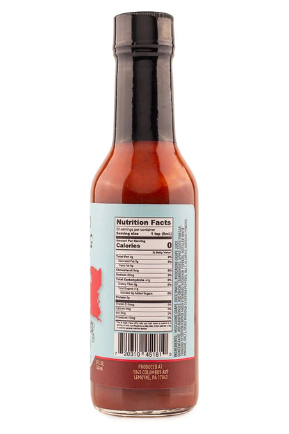 Bottle of Black Eyed Susan Red Flag hot sauce with nutrition facts label on a white background