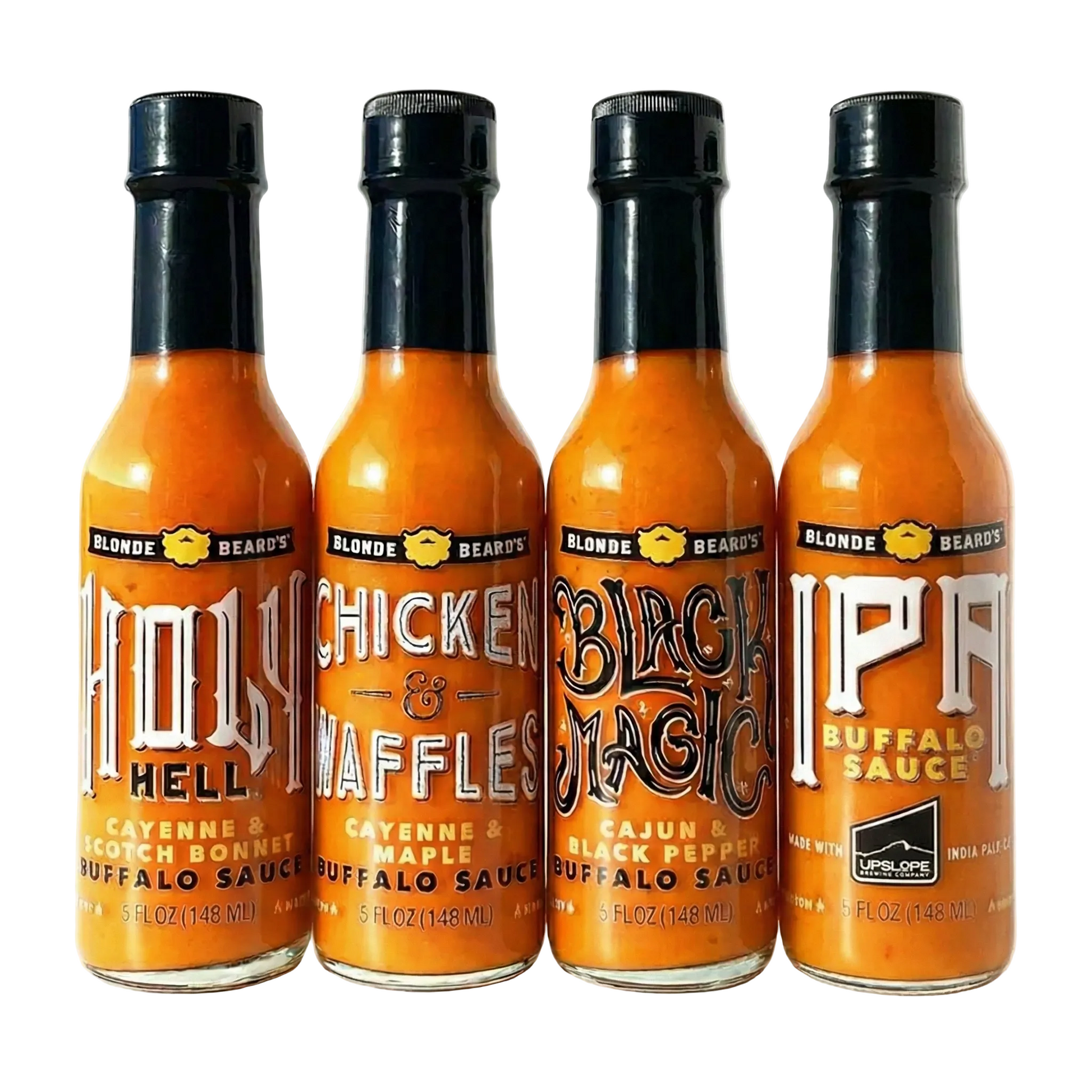 Four bottles of different types of Blonde Beard's Buffalo sauce on a white background