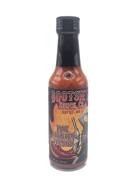 Bottle of Bootsie's Fire Roasted Fresno Hot Sauce on a white background