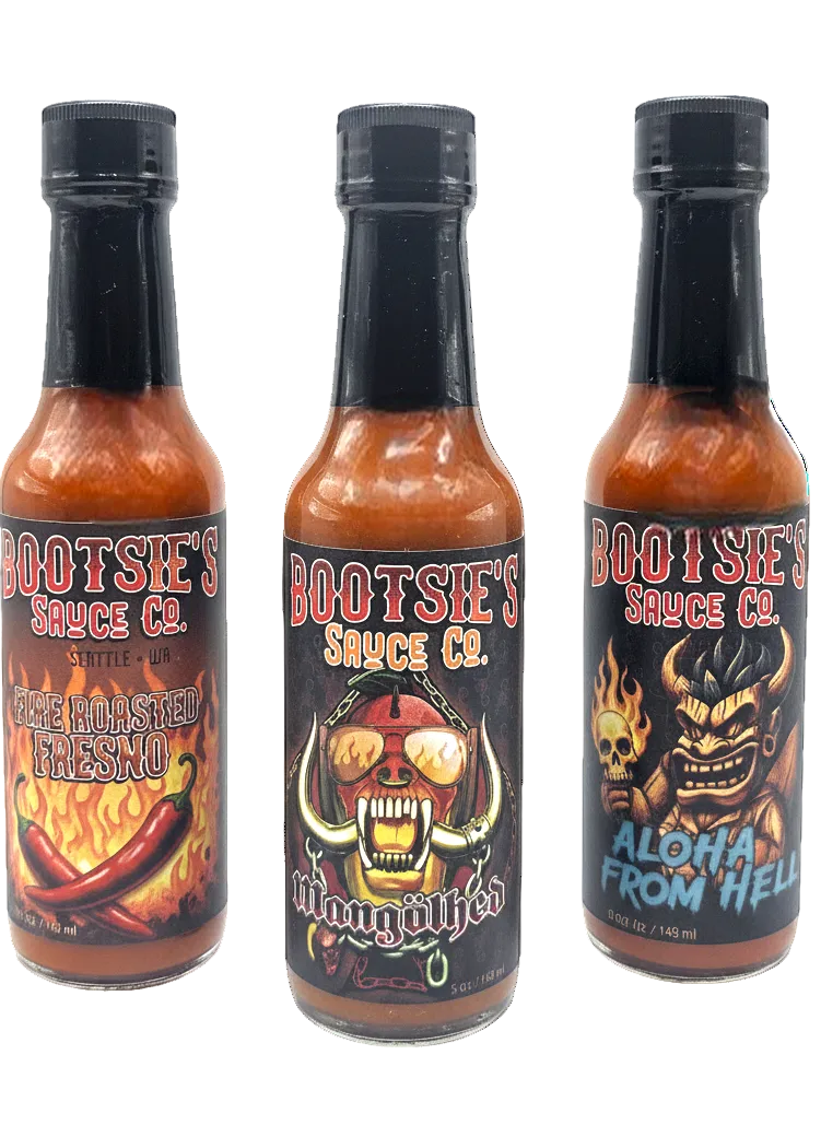 Three bottles of Bootsie's Sauce Co. hot sauce on a white background
