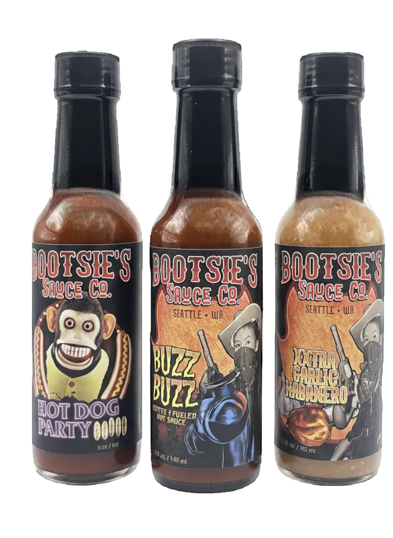 Three bottles of Bootsie's Sauce Co. with different labels on a white background