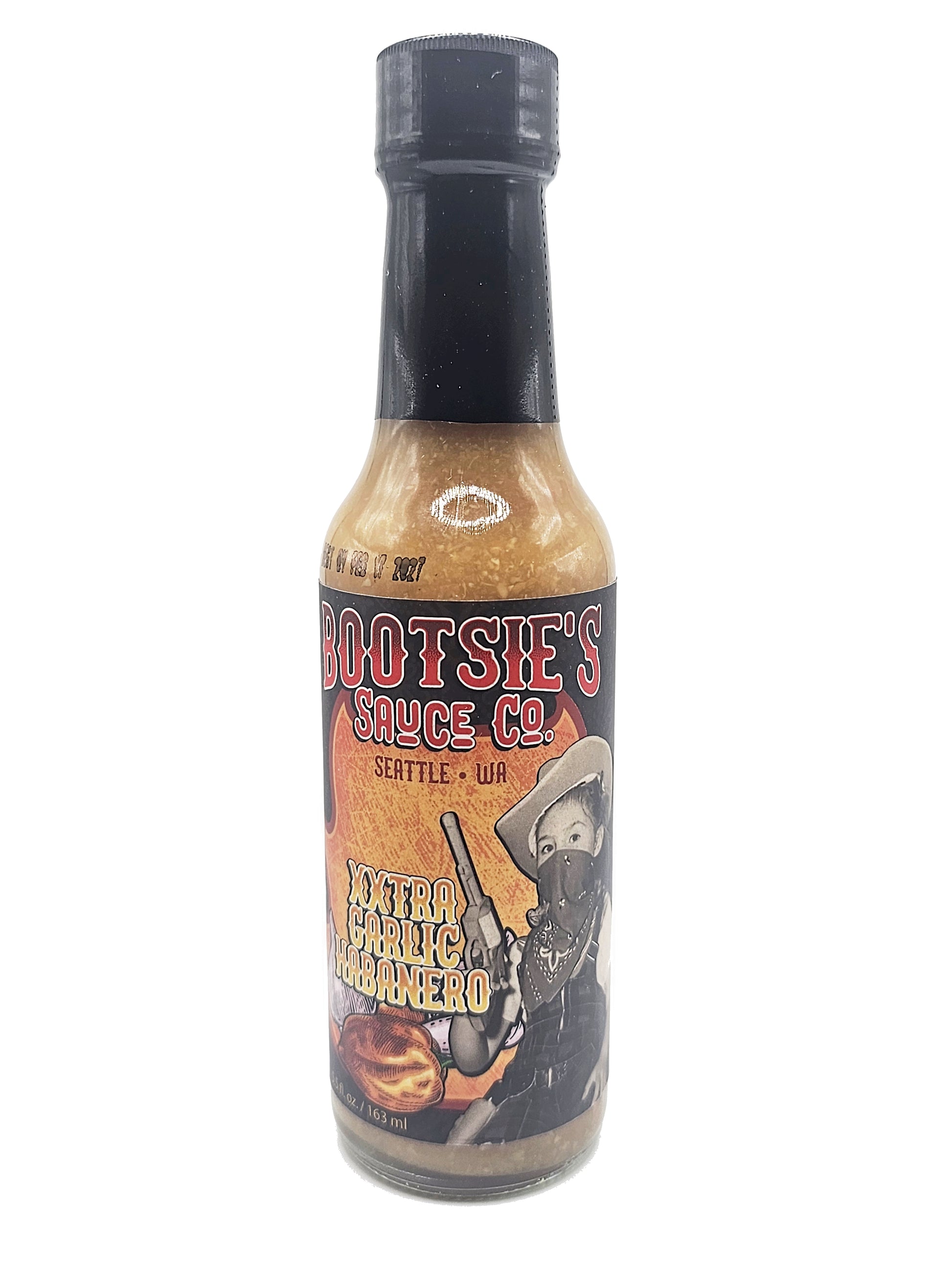 Bottle of Bootsie's Extra Garlic Habanero hot sauce with a label featuring a cowboy graphic