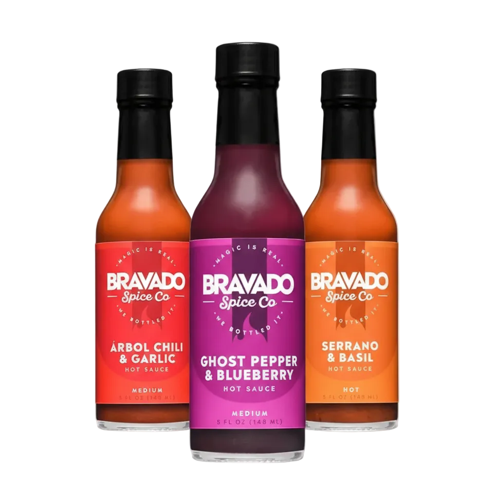 Three bottles of Bravado Spice Co hot sauces on a white background