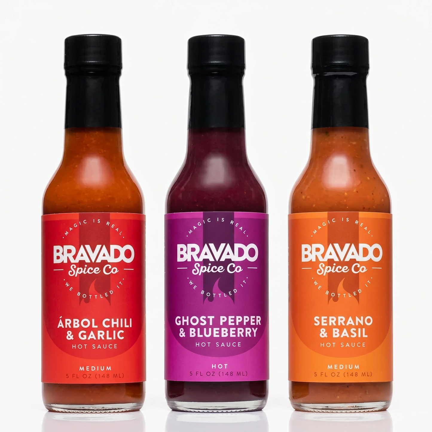 Three bottles of Bravado Spice Co hot sauces on a white background