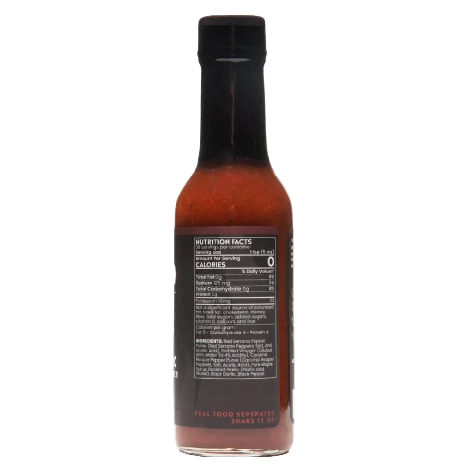Bottle of Bravado Black Garlic Carolina Reaper hot sauce with nutrition facts label