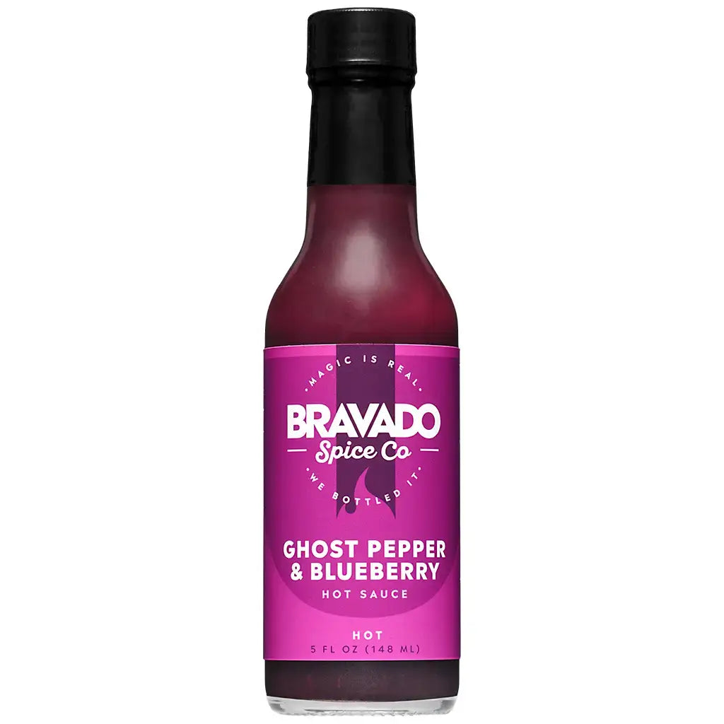 Bottle of Bravado Spice Co Ghost Pepper & Blueberry hot sauce on a white background