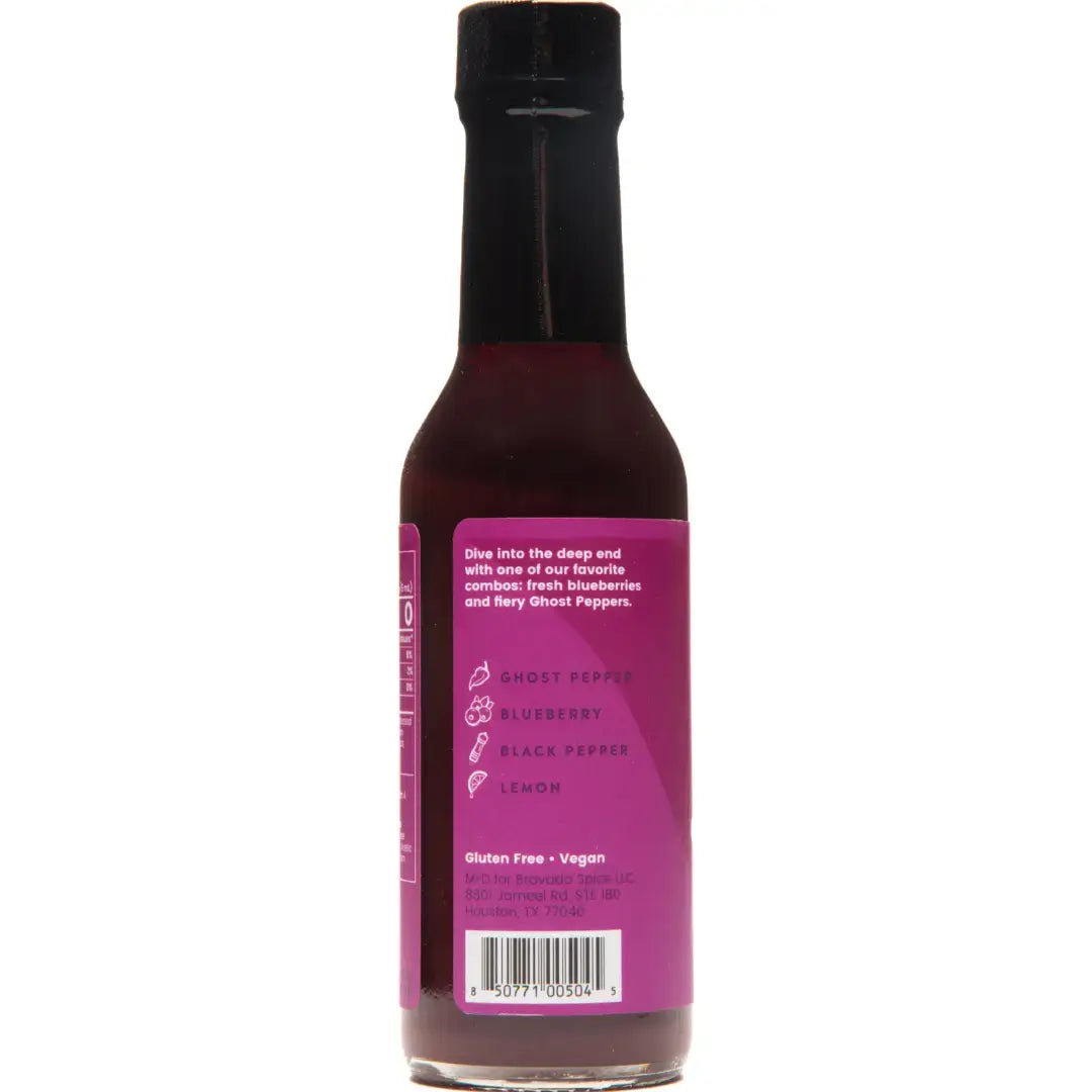 Bottle of Bravado hot sauce with a purple label on a white background