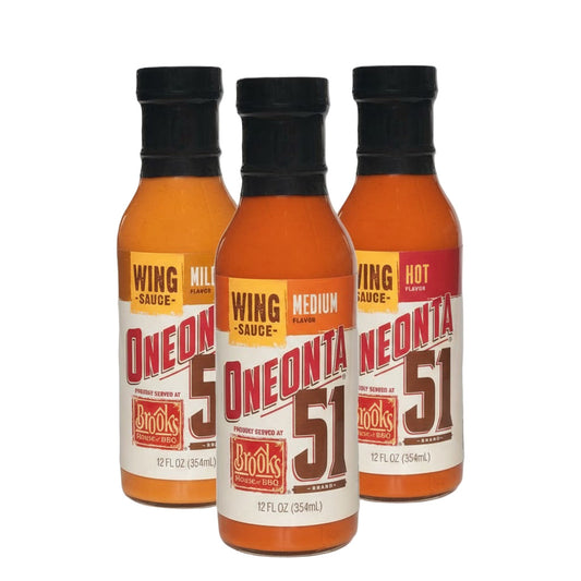 Three bottles of Oneonta 51 wing sauce on a white background