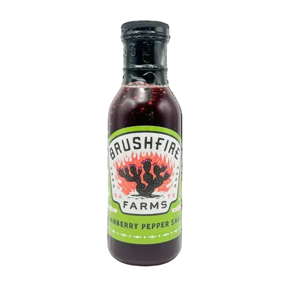 Bottle of Brushfire Farms raspberry pepper sauce on a white background