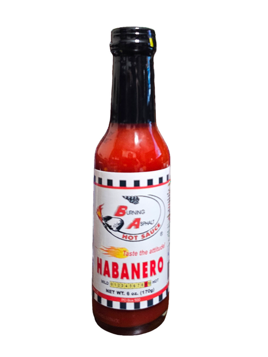Bottle of habanero hot sauce on a white background