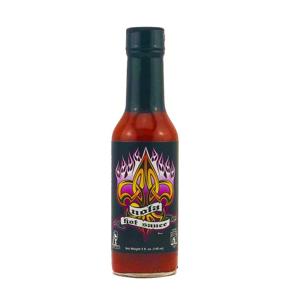 Bottle of hot sauce with a colorful label on a white background