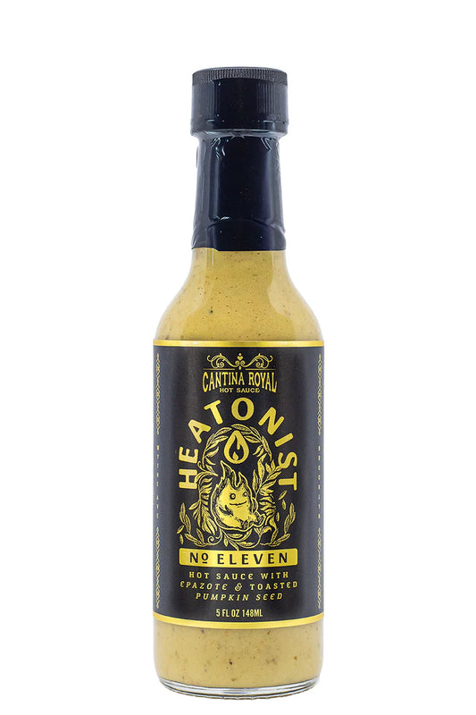 Bottle of Heatonist No Eleven hot sauce with a black label on a white background