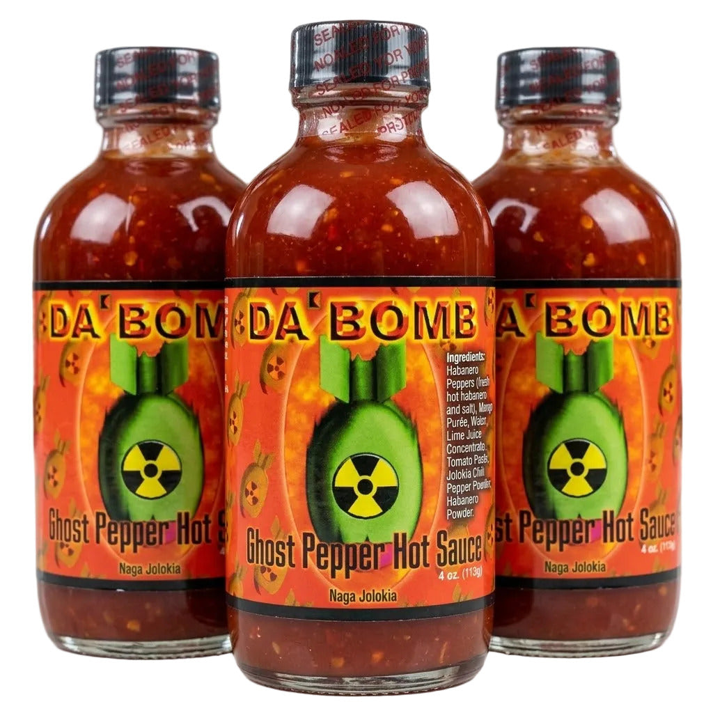 Three bottles of 'Da Bomb Ghost Pepper Hot Sauce' on a white background