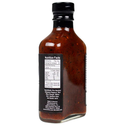 Bottle of barbecue sauce with a nutrition facts label on a white background