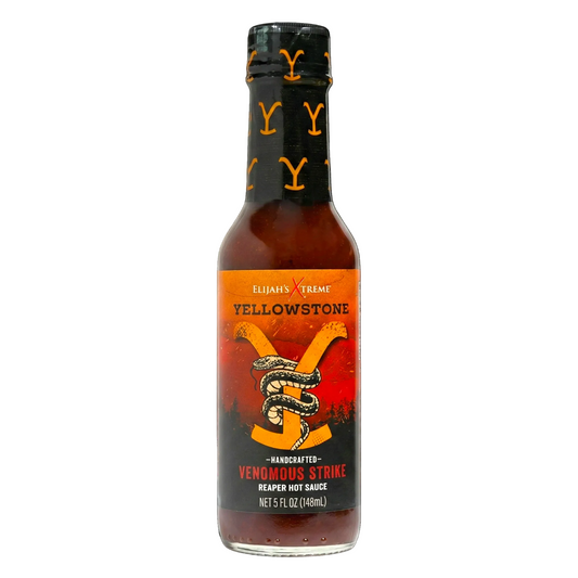 Bottle of Yellowstone hot sauce with a black cap on a white background