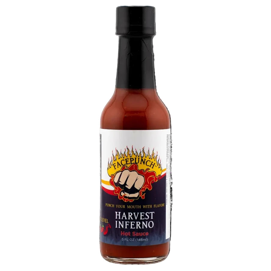 Bottle of Facepunch Harvest Inferno hot sauce on a white background