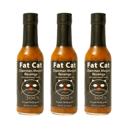 Three bottles of Fat Cat Chairman Meow's Revenge hot sauce on a white background