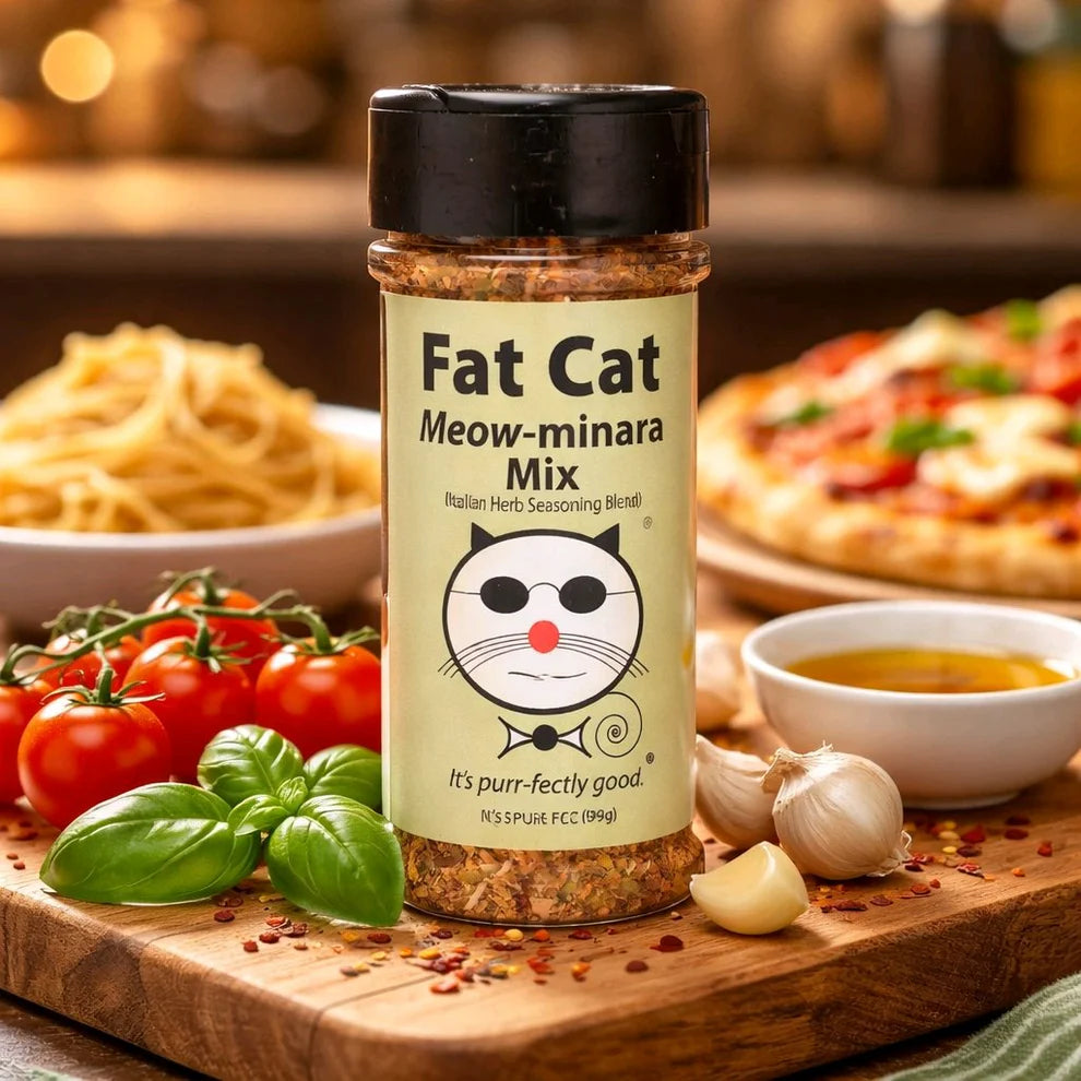 Fat Cat Meow-minara Mix seasoning bottle on a wooden board with food items in the background