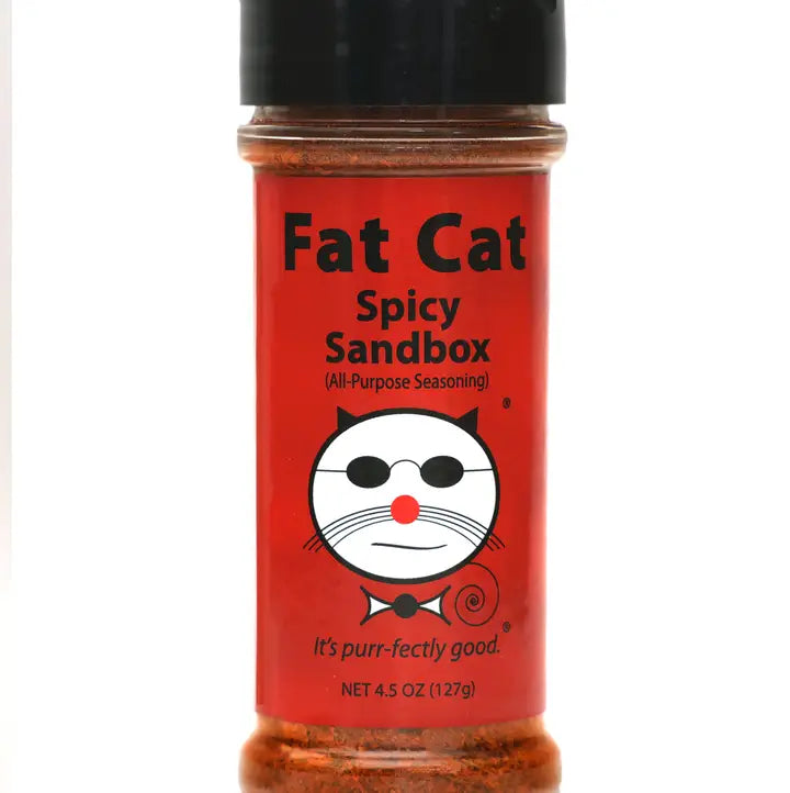 Spicy seasoning bottle labeled 'Fat Cat Spicy Sandbox' on a white background