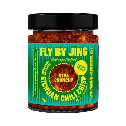 Jar of Fly By Jing Sichuan Chili Crisp with a black lid on a white background