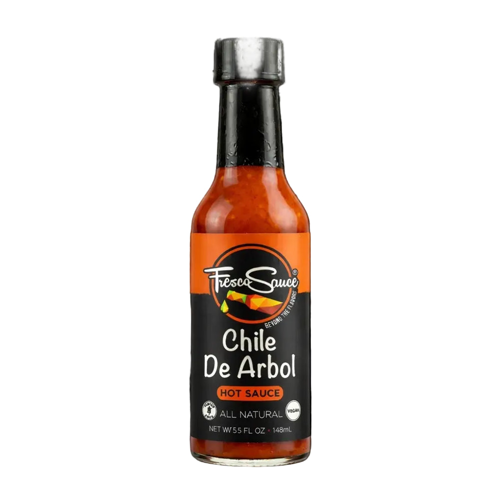 Bottle of Chile De Arbol hot sauce with a black cap on a white background