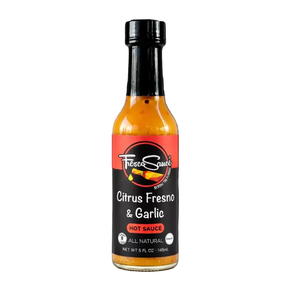 Bottle of Citrus Fresno & Garlic hot sauce on a white background