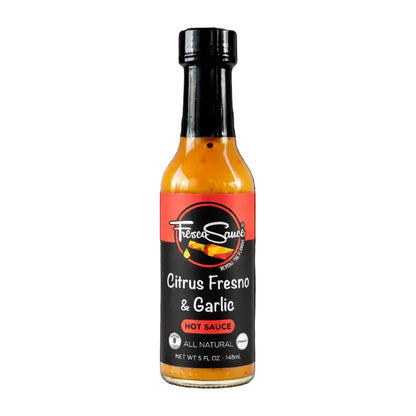 Bottle of Citrus Fresno & Garlic hot sauce on a white background
