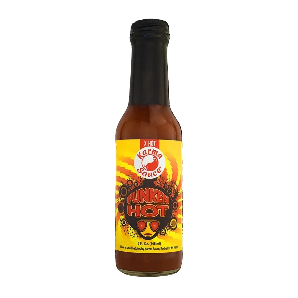 Bottle of Karma Sauce with a fiery design on a white background