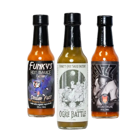 Three bottles of Funky's Hot Sauce Factory hot sauce on a white background