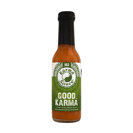 Bottle of Good Karma hot sauce on a white background