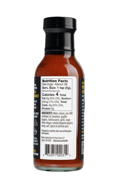 Bottle of Guajillo sauce with nutrition facts label on a white background
