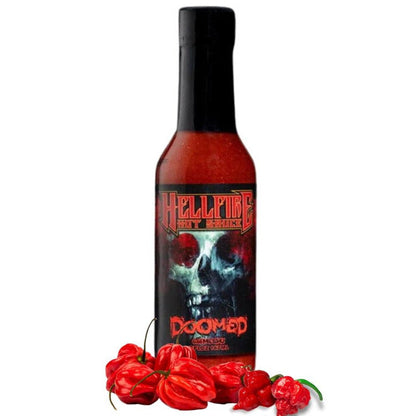 Hellfire Doomed Hot sauce bottle with skull design and red peppers on a white background
