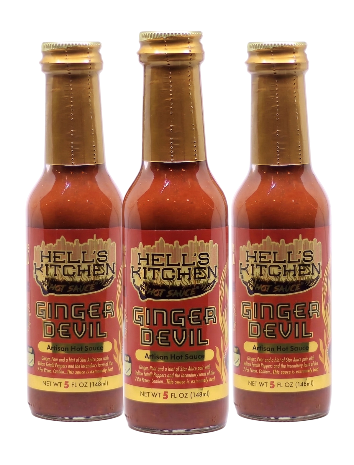 Three bottles of Hell's Kitchen Ginger Devil Afzain Hot Sauce arranged side by side on a white background.