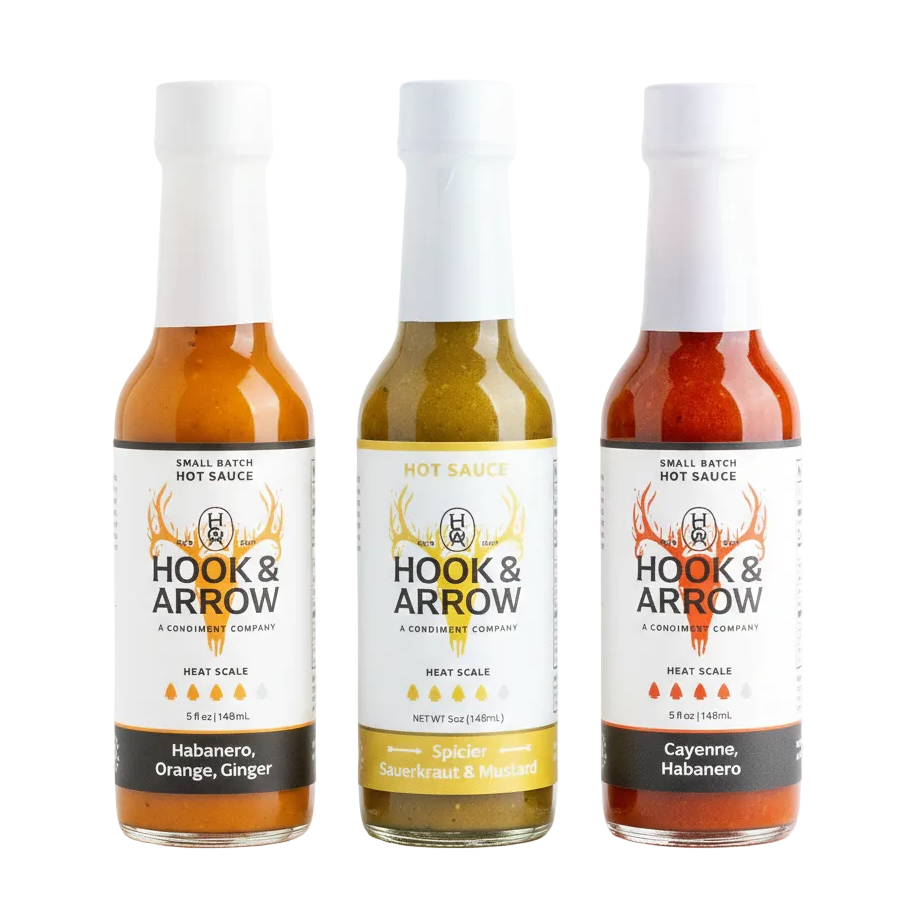 Three bottles of Hook & Arrow hot sauce on a white background