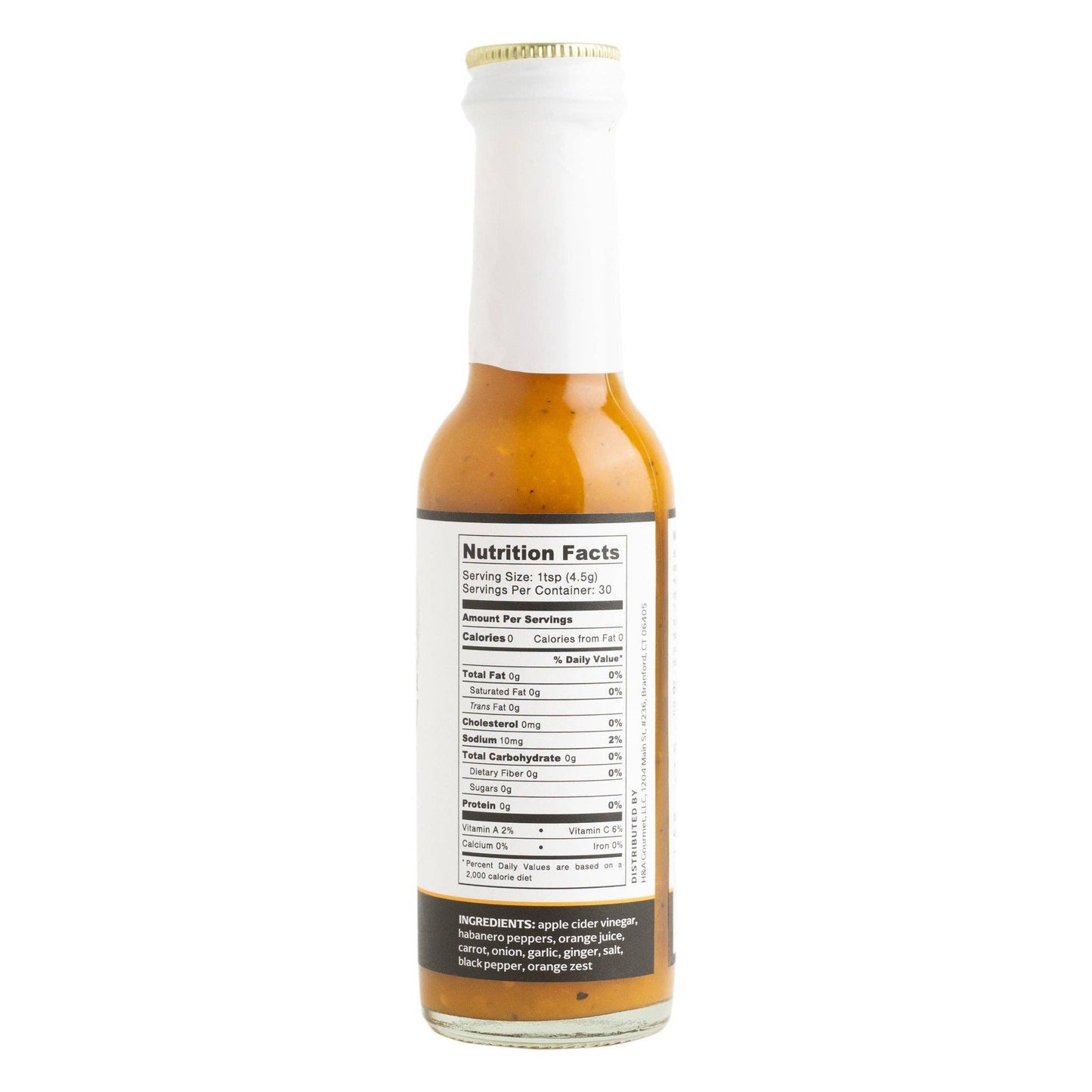 Hot sauce bottle with nutrition facts label on a white background