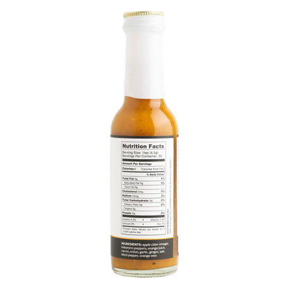 Hot sauce bottle with nutrition facts label on a white background