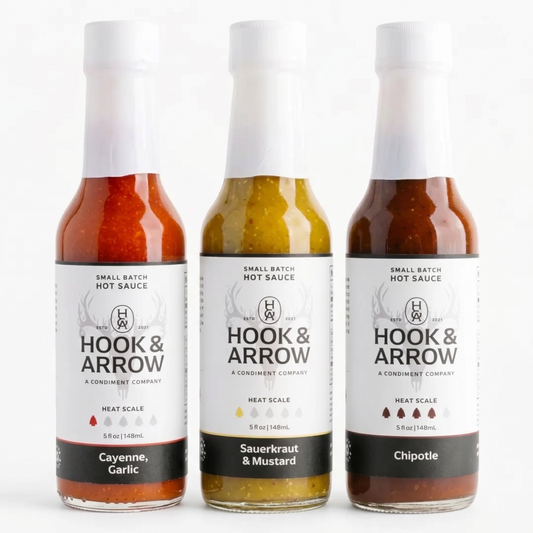 Three bottles of Hook & Arrow hot sauce on a white background