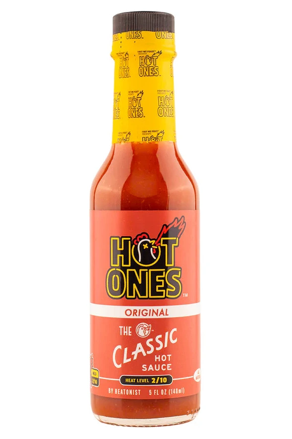 Hot Ones hot sauce bottle with yellow label on a white background