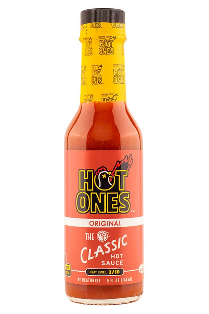 Hot Ones hot sauce bottle with yellow label on a white background