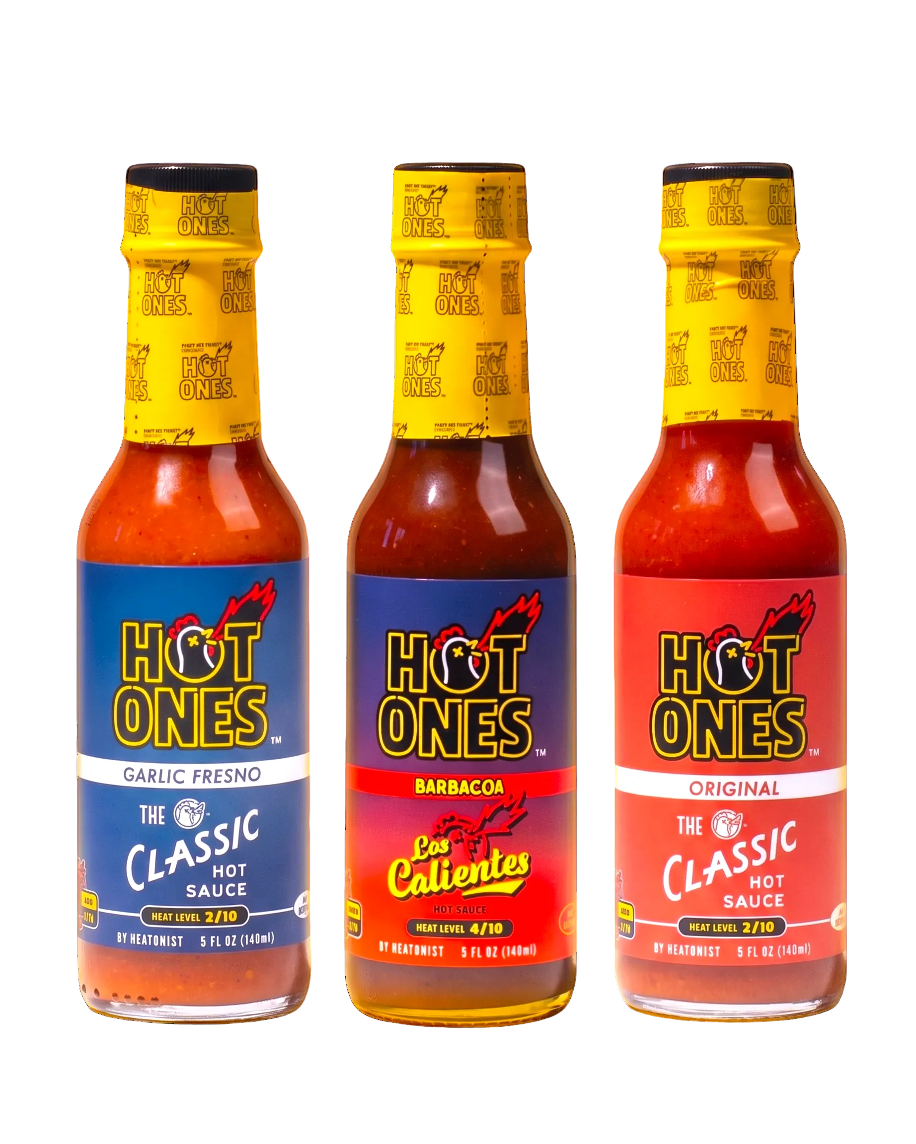Three bottles of Hot Ones hot sauce with different flavors on a white background